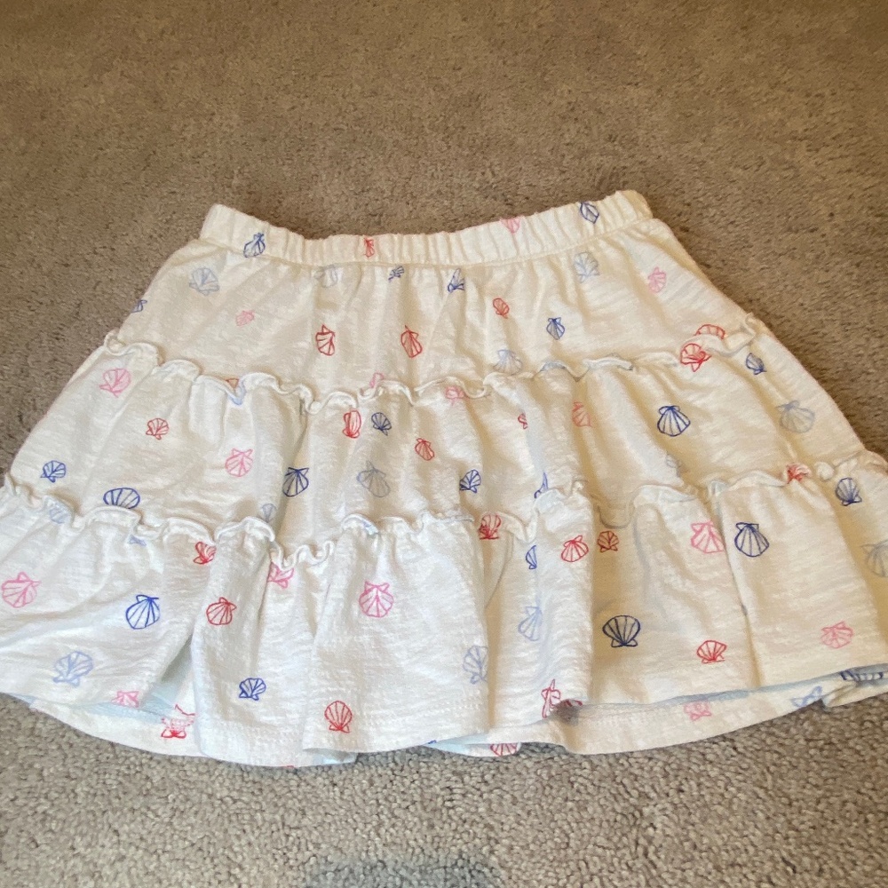 Cream skirt with pink, red, and blue sea shel skirt